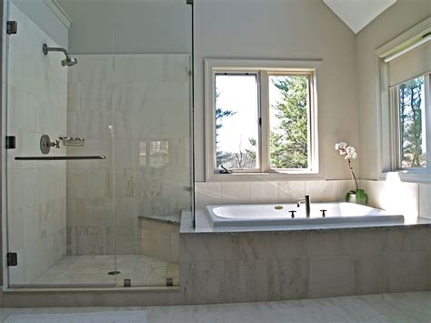Built In Tub Next To Shower With Knee High Wall In Between Glass All