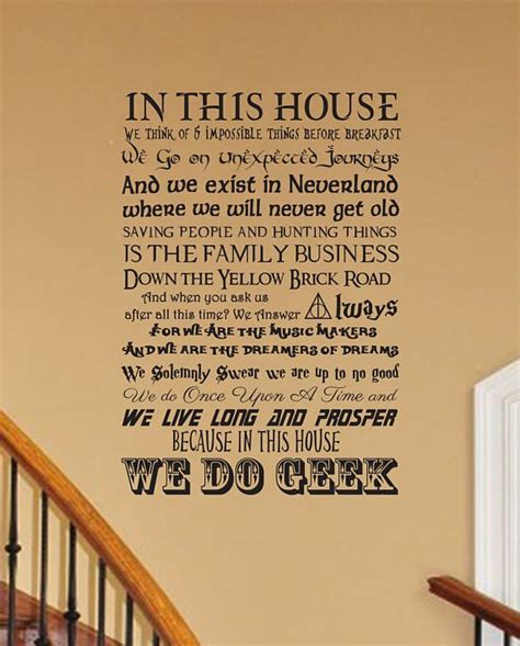 The Words In This House Wall Decal Is Shown Above A Stair Case And Handrail