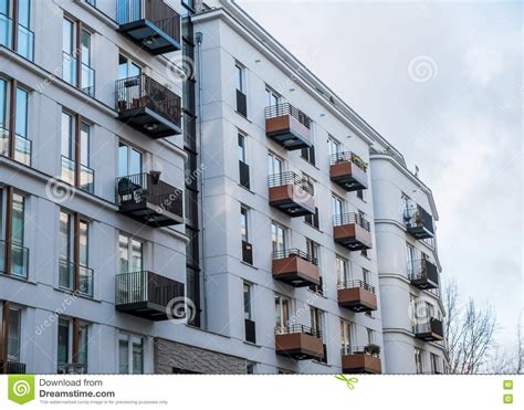 Modern Apartment Building With Small Balconies Stock Photo