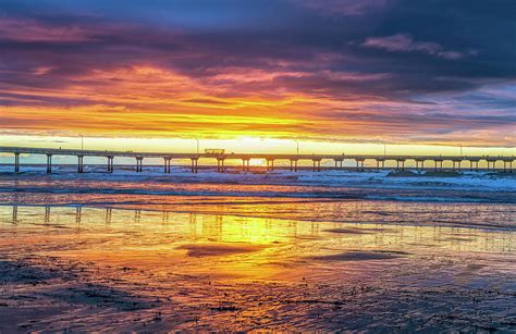 A Purple And Orange Sunset Ocean Beach Photograph By