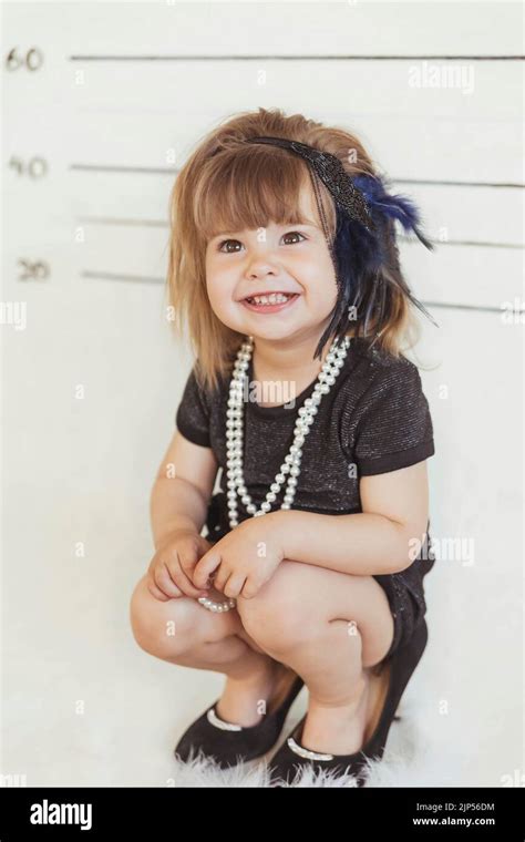 Charming Baby In Gangster Costume At The Police Station Stock Photo Alamy