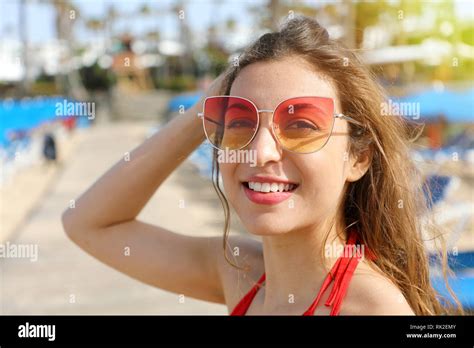 Close Up Image Of Happy Smiling Brunette Woman In Sunglasses And Bikini Posing On The Beach
