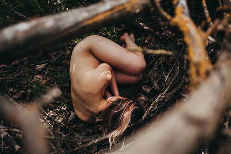 Nude Woman Lying On Ground In Forest By Stocksy Contributor Leah
