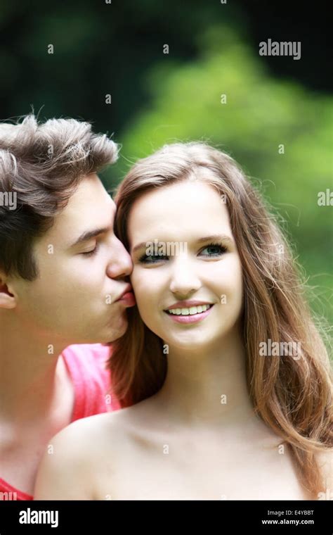 Young Man Kissing His Girlfriend Stock Photo Alamy