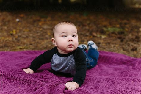 Baby On Purple Blanket Del Colaborador De Stocksy Leah Flores Stocksy