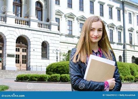 Young Girl Outdoor Holding Books Stock Photo Image Of Academic