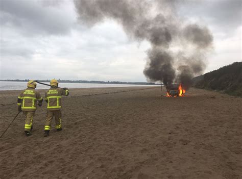 Firefighters Use Sand To Put Out Car Fire On Beach Photo 1 Of 3