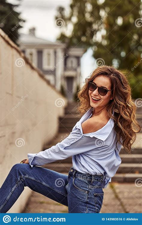 Young Happy Woman With Long Brown Hair In Sunglasses Blue