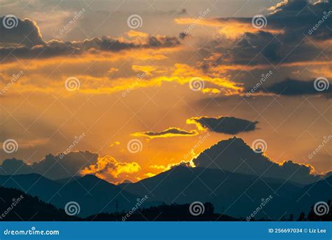 Dramatic Panorama Evening Sky And Clouds Over Mountain And Lake At