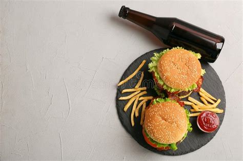 Set Of Burgers With French Fries And Ketchup Sauce Stock Photo Image