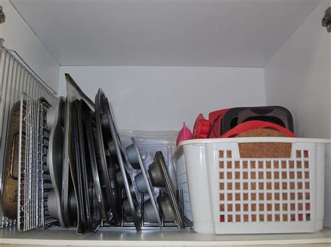 Kicking off the summer with some organized cupboards and drawers in the kitchen! Cassadiva: Organising Kitchen Cupboards - Baking Tins