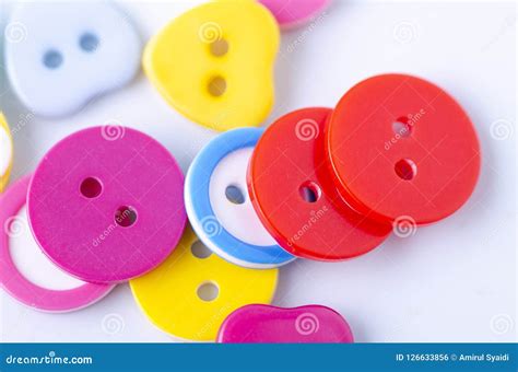 Colorful Buttons With Variety Of Shape On White Background Stock Photo
