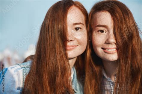 Close Up Shot Of Two Redhead Sisters With Cute Freckles And Charming