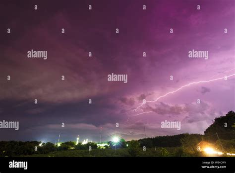 Storm And Bright Lightning Strike At Dusk At Night Stock Photo Alamy