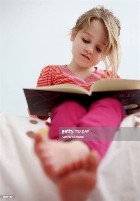 Young Girl Reading Book High Res Stock Photo Getty Images