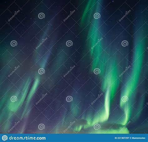 Aurora Borealis Northern Lights With Stars Glowing In The Night Sky