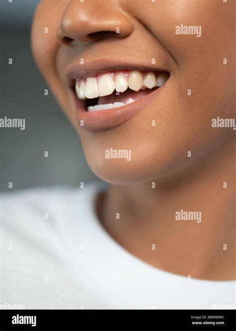 Closeup Of Woman Smiling With Prefect White Teeth Isolated Over