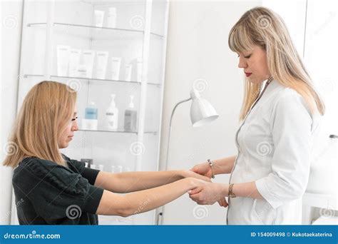 Dermatologist Makes A Primary Examination Of The Patient`s Skin