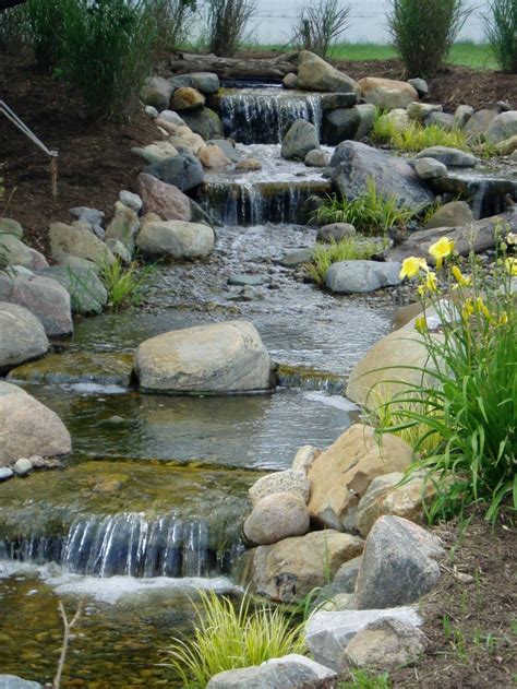 You'll still want room for gatherings, cookouts and lounging. Here's a lovely pond waterfall with four levels ...