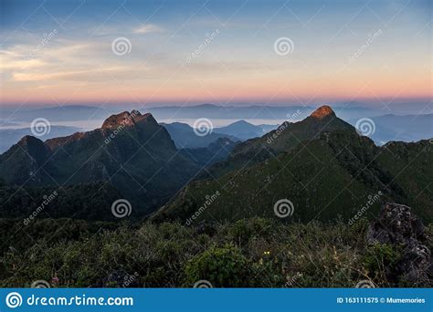 Landscape Of Mountain Range In Wildlife Sanctuary At Sunrise Stock