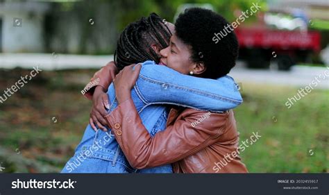 Two Friends Empathic Hug African Women Stock Photo 2032455917