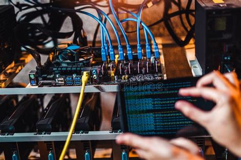 Mining rigs sound complex and tricky the first time, but it helps when a pro dumbs things down for you. Programmer Adjusting Cryptocurrency Mining Rig Stock Photo ...
