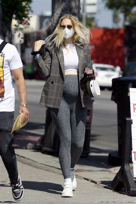 Sophie Turner Shows Off Her Growing Baby Bump In A Crop Top And