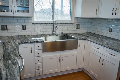 Maybe you would like to learn more about one of these? White Cabinets with Silver Cloud Granite Countertops ...