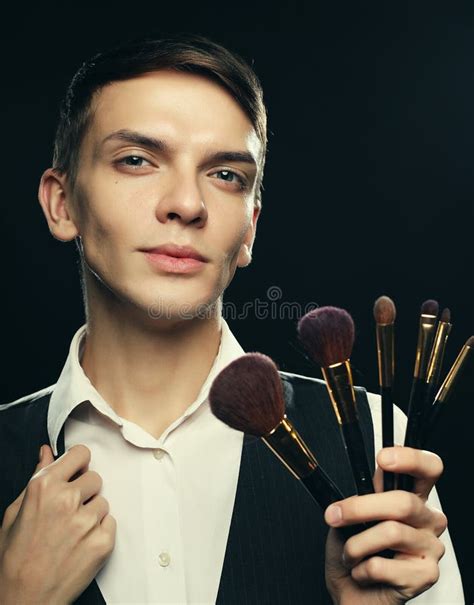 Professional Makeup Artist Posing In Studio Holds A Palette Of Shadows
