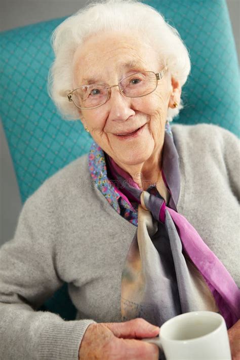 Elderly Woman Looking Comfortable Drinking Tea Stock Image Image Of