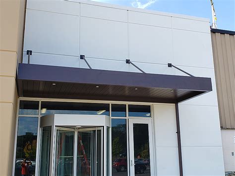 This metal canopy offers excellent shelter and can withstand adverse climatic conditions. Architectural Metal Canopies - Awning Partners