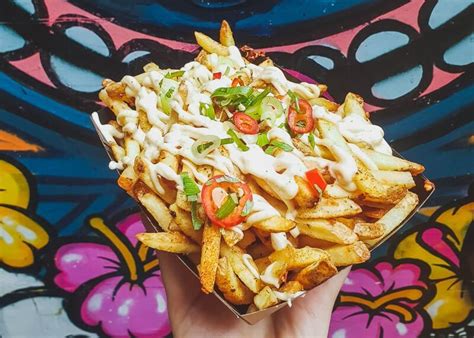 Portion Of Fries With Jerk Spice Jerk Mayonnaise Chilli And Spring