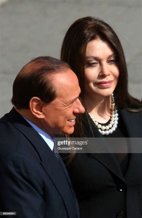 Italian Premier Silvio Berlusconi And His Wife Veronica Arrive For News Photo Getty Images