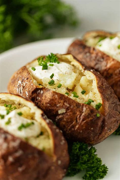 Wrap the potatoes in foil and put them on a baking sheet. How to Make Baked Potatoes + Recipe Video | Kevin is Cooking