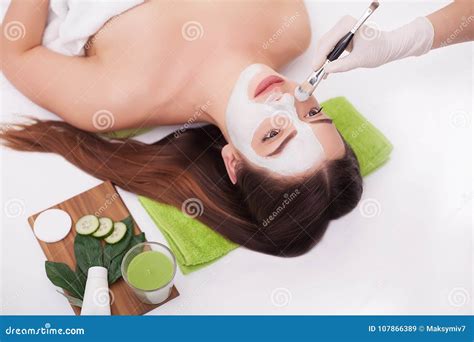 Spa Woman Applying Facial Cleansing Mask Beauty Treatments Stock Image Image Of Facial Face