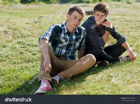 Two Young Men Sitting Together On Stock Photo 141378580 Shutterstock