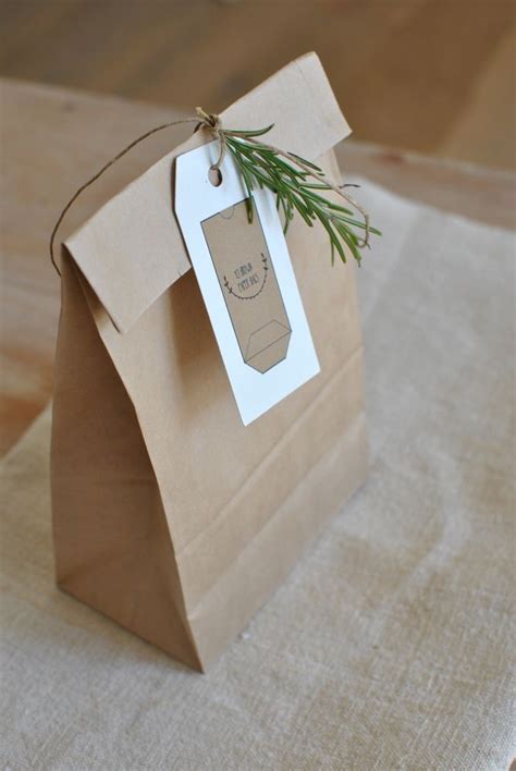 Brown Paper Bag With Twine Tied Rosemary Sprig Label