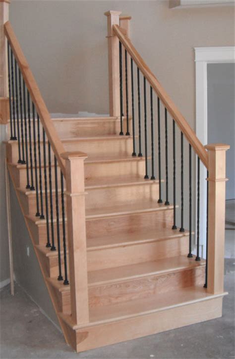 The newel sets the tone for the overall staircase, and the balusters carry the tone in the design (while a bit less elaborate than the newel designs) through the staircase. Craftsman Newels & Metal Balusters - Traditional - Staircase - other metro - by Scotia Stairs