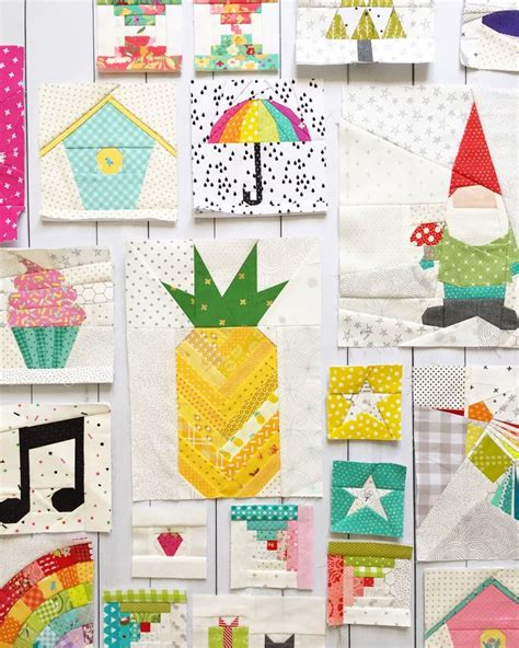 Many Different Quilts Are Hanging On The Wall With Colorful Designs And