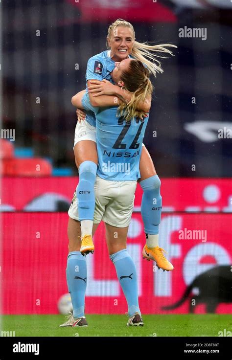 manchester city s sam mewis back to camera celebrates scoring her side s first goal of the