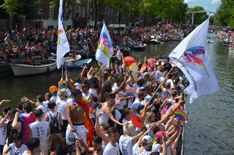 amsterdam netherlands august 06 2022 many people in boats at lgbt pride parade on river