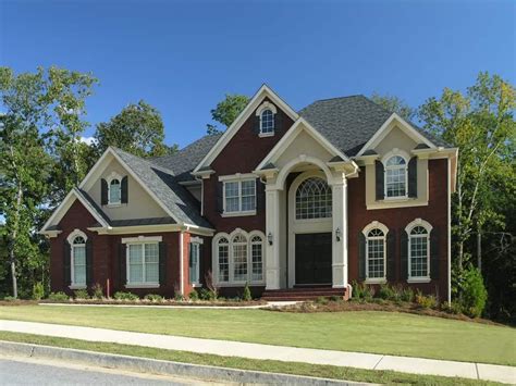 New Large Suburban Red Brick Home With Arched Windows Side Garage