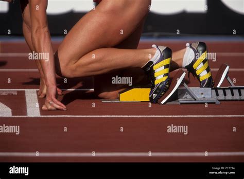 Detail Of Female Sprinter In The Starting Blocks Stock Photo Alamy