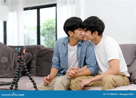 Two Young Asian Men Gay Couple Blogger Kissing While Recording Video