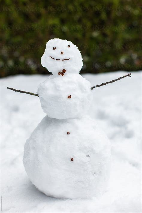 Closeup Of A Simple Snowman In Snowy Forest In Snowfall By Stocksy