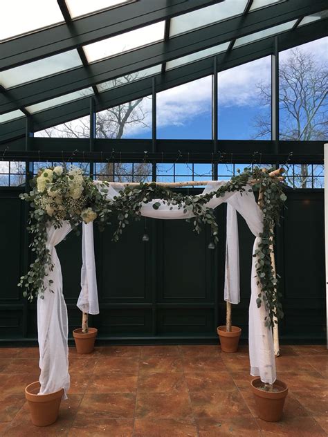 A Beautiful But Simple Birch Chuppah With Sheer Material And White