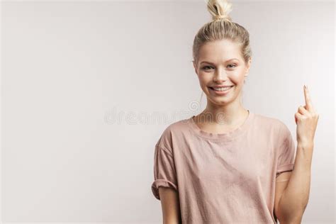 Cheerful Young Woman Finding New Idea And Raising Index Finger Up