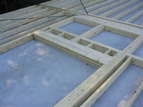 How to frame garage door opening for most roll up doors. The Triton Daysailor | Boat Barn Framing Details