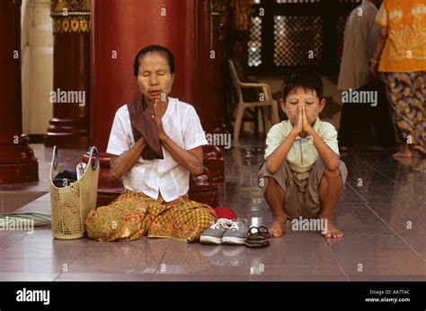 Mother And Son Praying At Shwedagon Pagoda Rangoon Yangon Burma Myanmar
