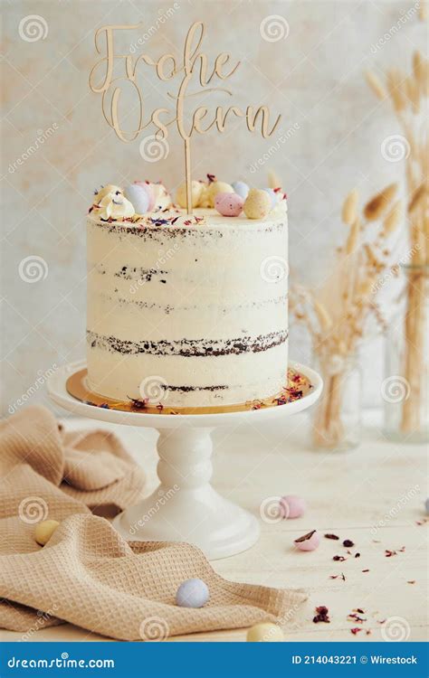 Vertical Shot Of A Delicious Happy Easter Frohe Ostern Naked Cake On A White Table Stock Image
